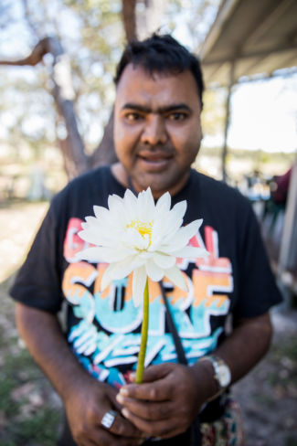 Man holding a flower